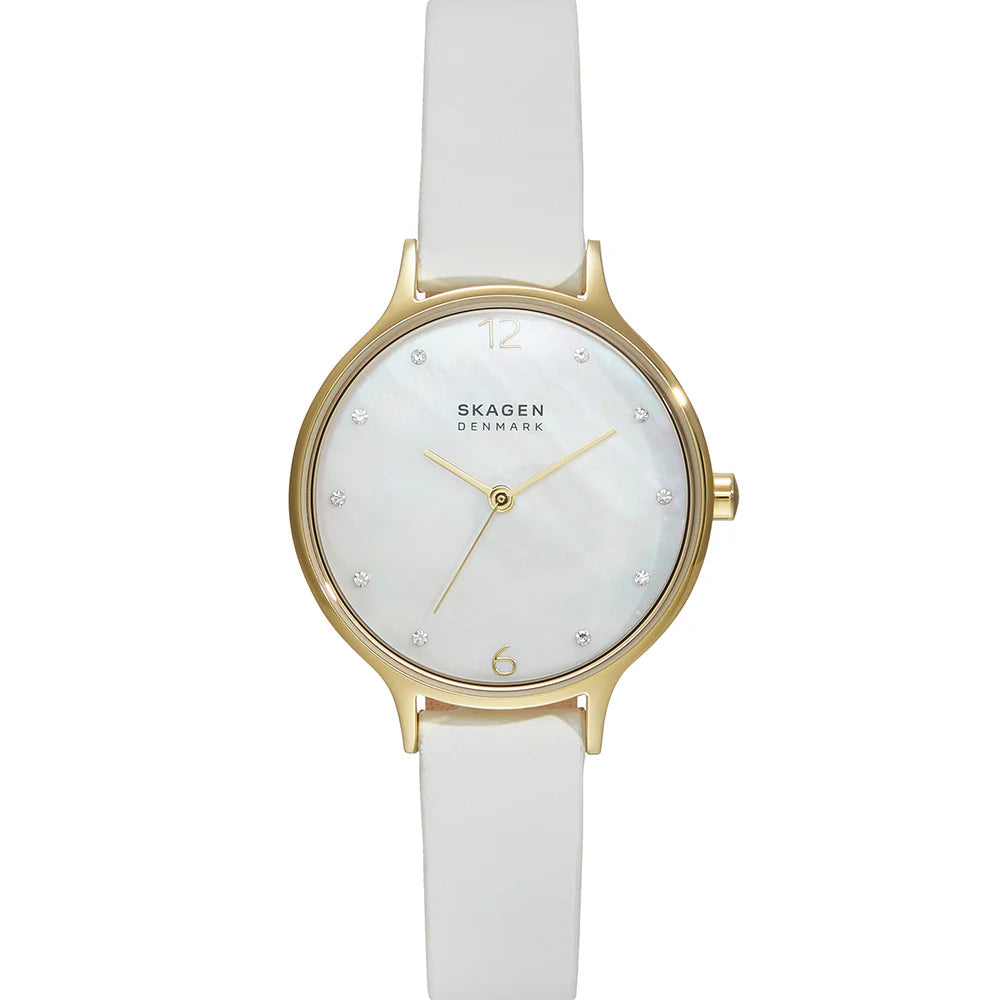 The Fossil Skagen Watch - Anita Lille - SKW3138 showcases a minimalist look with a white leather band, gold-tone case, mother of pearl dial, gold markers and hands, plus sparkling crystals at each hour.