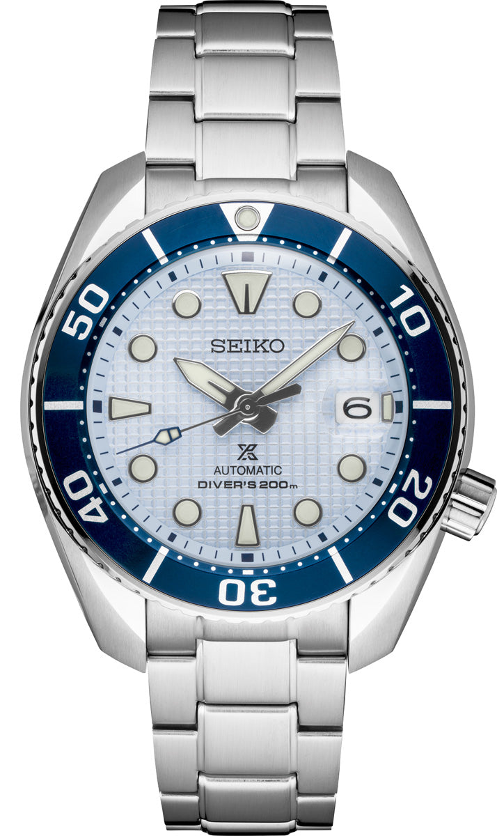 The Seiko Luxe Ice Diver Special Edition SPB179 features a silver bracelet, blue bezel, light blue textured dial, luminous markers, date window at 3 o’clock, and 200m water resistance.