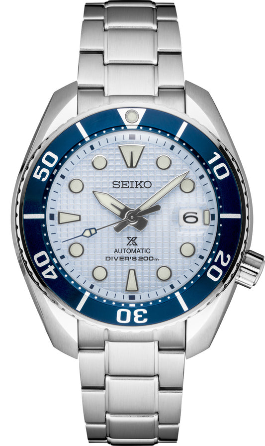The Seiko Luxe Ice Diver Special Edition SPB179 features a silver bracelet, blue bezel, light blue textured dial, luminous markers, date window at 3 o’clock, and 200m water resistance.
