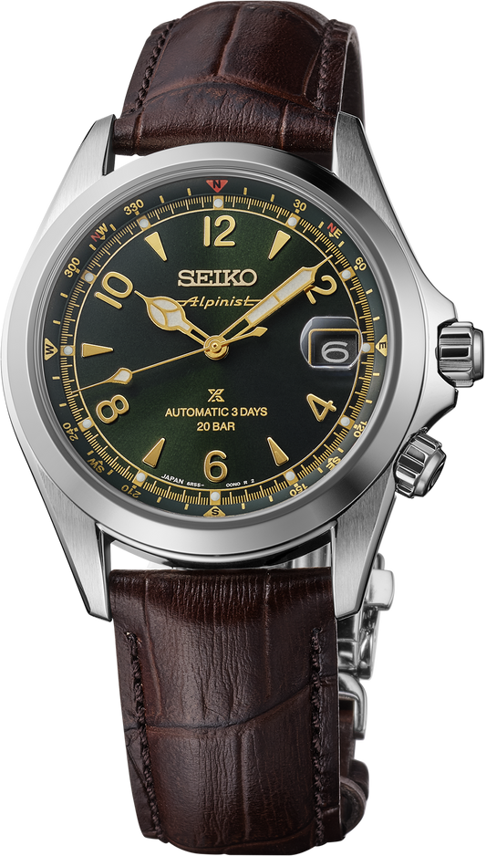 The Seiko Watch - Luxe Prospex Alpinist SPB507 features a green dial, stainless steel case with gold accents, date window at 3 o'clock, brown leather strap, automatic movement (3 days), 20 bar water resistance, and an arrow-shaped second hand.