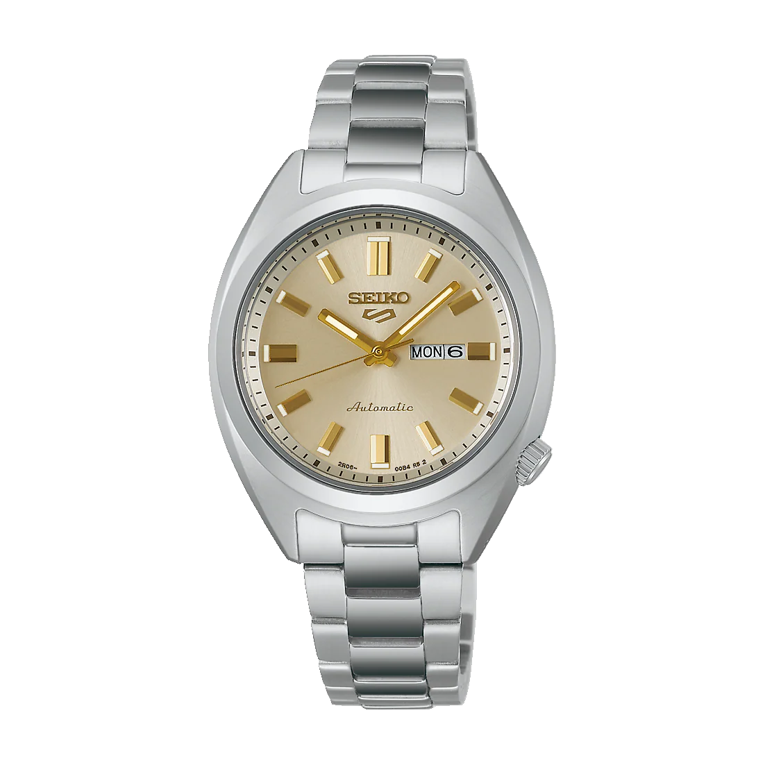 The Seiko 5 SRE023 is a silver automatic watch from Seiko, featuring a stainless steel band, gold hour markers and hands, a beige dial, and a day-date window at 3 o’clock showing MON 6.