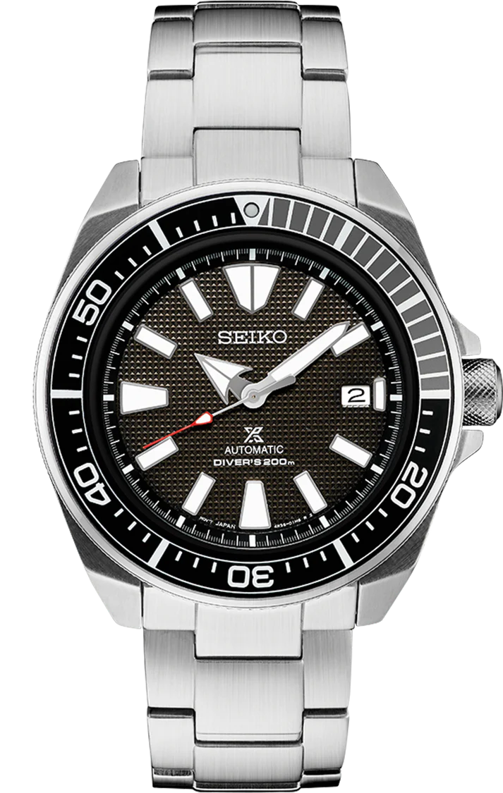 The Seiko Prospex Automatic Diver SRPF03 is a rugged 200m water-resistant stainless steel watch featuring a black textured dial, bold white markers, date at 3 o’clock, unidirectional bezel, and silver bracelet.