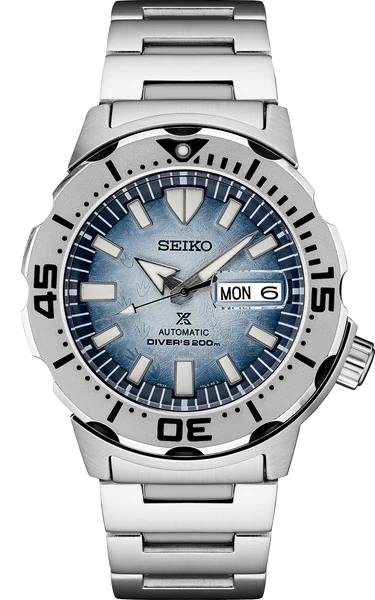 The Seiko Watch - SRPG57 Prospex Save the Ocean Special Edition is an automatic diver with a blue gradient dial, bold markers, rotating bezel, day-date at 3 o'clock, 200m water resistance, and stainless steel bracelet.
