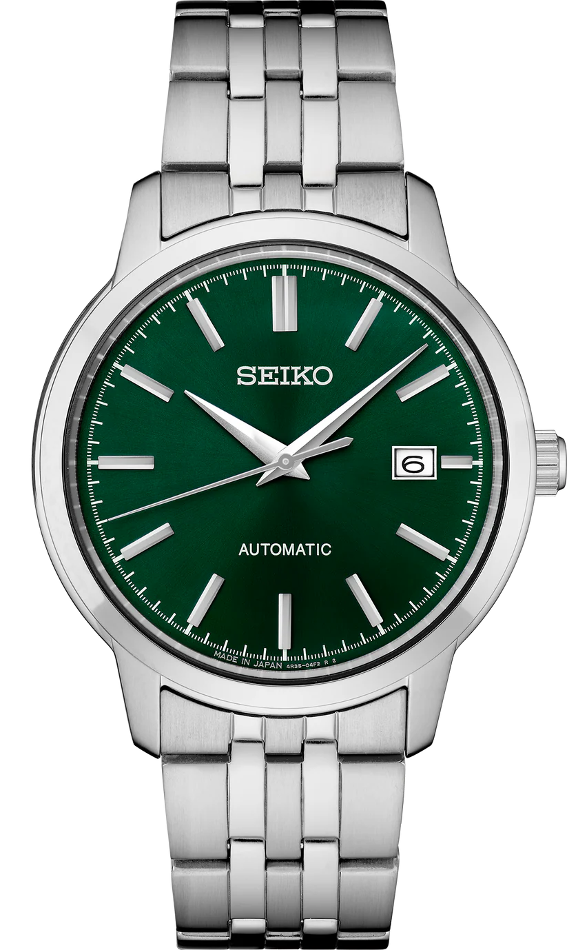 The Seiko Watch - Essentials Automatic SRPH89 is a stainless steel timepiece featuring a striking green dial with silver hour markers and hands, along with a date window at 3 o’clock. This automatic watch from Seiko combines everyday practicality with style, offering a sturdy metal link bracelet and 100M water resistance.