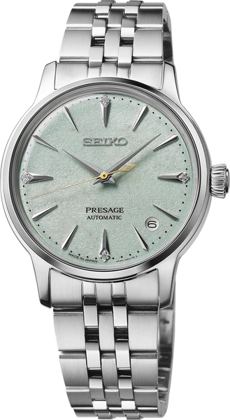 The Seiko Presage Cocktail Time SRPL63 is an automatic Japanese watch with a silver metal band, light green textured dial, silver hour markers, three hands, date window at 3 o’clock, and a round stainless steel case.