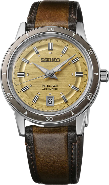 The Seiko Presage Style60s SRPL75 features an automatic movement, textured gold dial, silver hour markers, date at 6 oclock, and a brown leather strap with visible stitching.