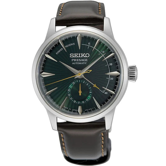 The Seiko Presage SSA459 by Seiko features a green sunburst dial, gold and silver markers, subdial, power reserve and date indicators, plus a brown leather strap with white stitching for classic Cocktail Time elegance.