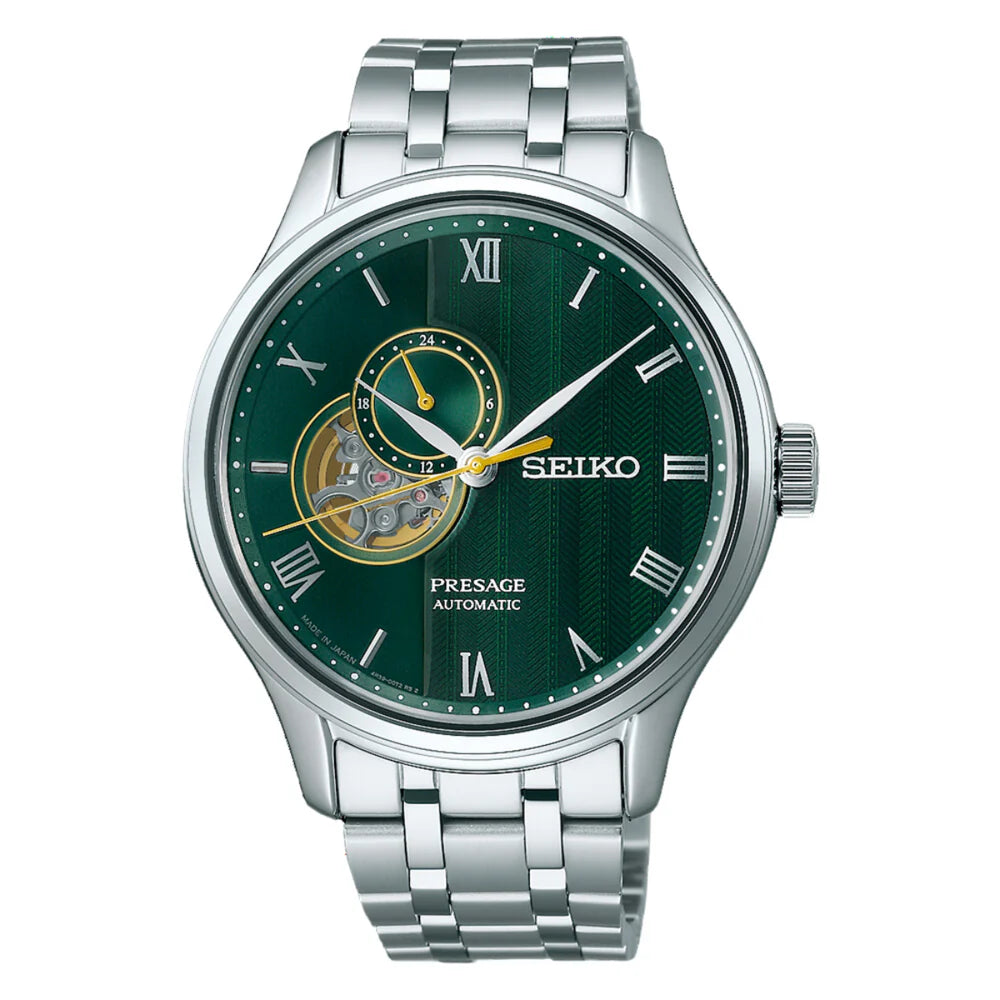 The Seiko Watch - Presage Automatic SSA463 features automatic movement, a silver stainless steel band, green dial with Roman numerals, open-heart detail, 24-hour subdial, and gold and white accents on the hands.