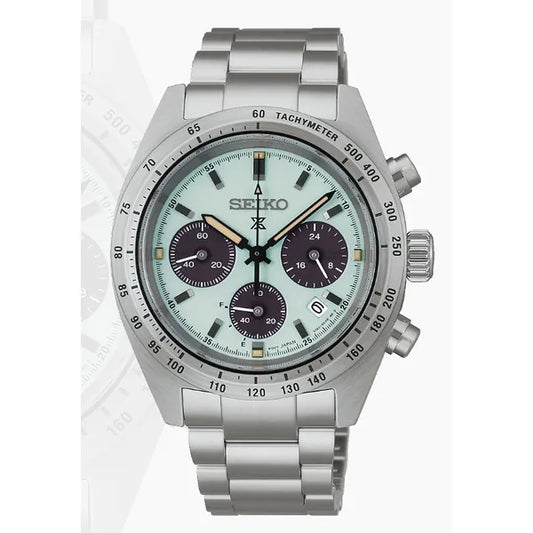 The Seiko Prospex SSC965 is a solar chronograph watch featuring a stainless steel band, light green dial with three black sub-dials, date at 4 o’clock, tachymeter bezel, and two pushers beside the crown on the right.