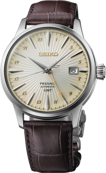 The Seiko Presage Cocktail Time GMT SSK041 features a textured beige dial, gold-tone hands and indices, date at 3 o’clock, and a brown leather strap—a refined Japanese automatic watch for any occasion.