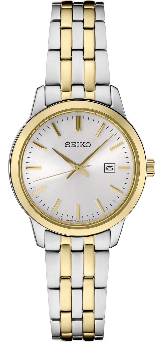 A Seiko Watch - Ladies’ Essentials - SUR410, featuring a two-tone stainless steel design, a minimalist white dial with gold markers, a date window at the three o’clock position, and a silver and gold link bracelet.