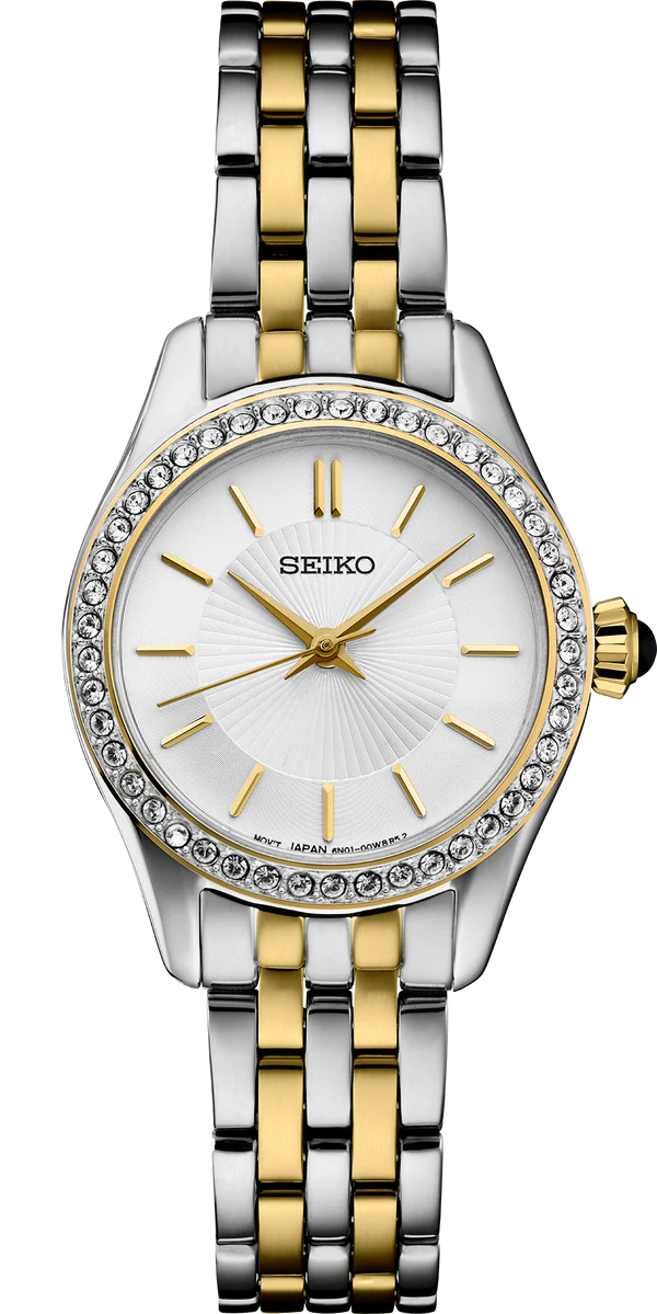 The Seiko Crystal Collection SUR540 ladies watch features a two-tone stainless steel band, round white dial, gold hour markers and hands, and a crystal-adorned bezel.