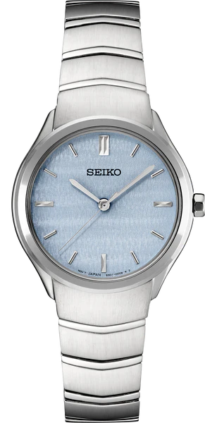 The Seiko Essentials Collection SUR549 is a silver wristwatch with a pale blue textured dial, silver hour markers and hands, and a brushed metal link band. Its minimalist design offers simple elegance.