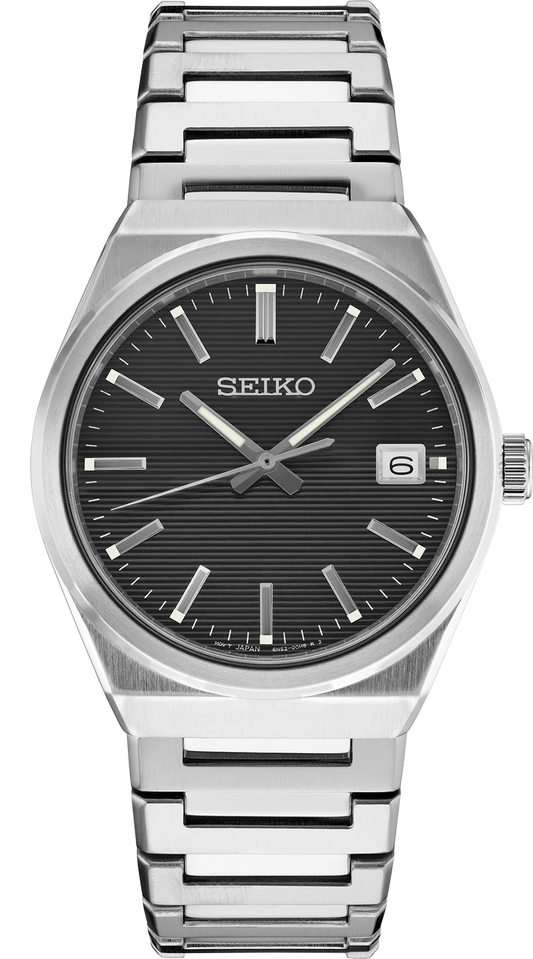 Seiko Essentials SUR557 analog watch with a horizontal-textured black dial, silver baton indices, and a stainless steel link bracelet.