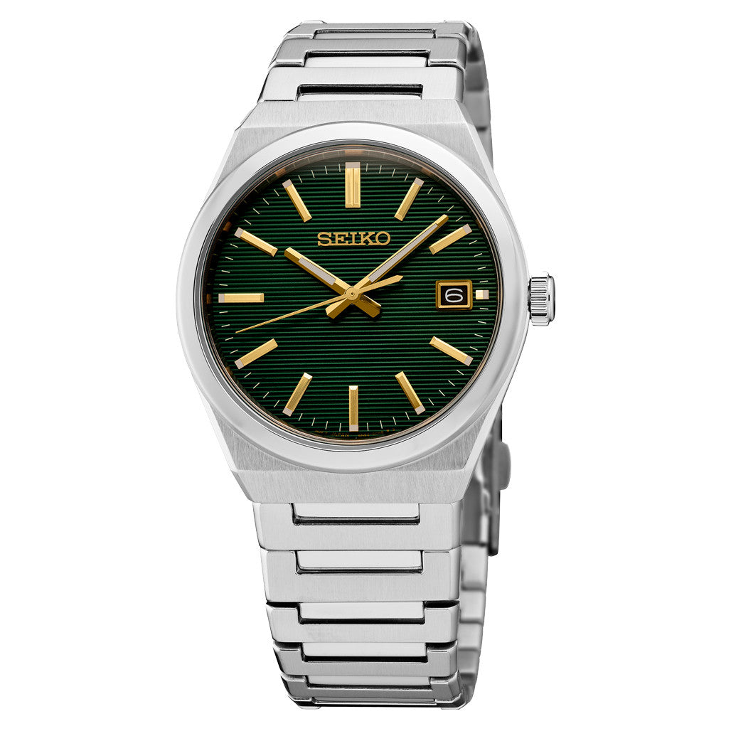The Seiko Essentials Collection SUR601 features a green textured dial, gold markers and hands, date window at 3 o'clock, silver metal bracelet, durable sapphire crystal, and precise quartz movement.