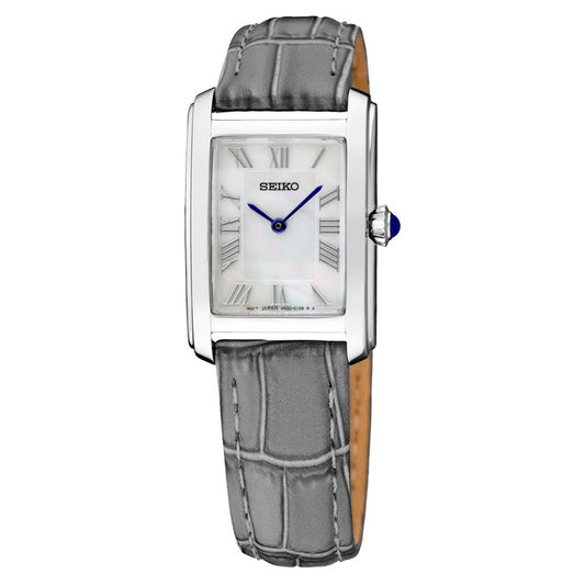 The Seiko Essentials SWR099 watch features a rectangular silver-tone case, white dial with blue hands and Roman numerals, a grey crocodile-pattern leather strap, and precise quartz movement.