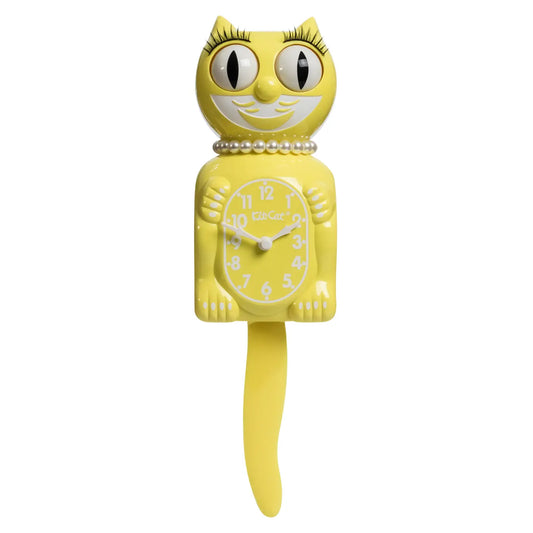 The California Clocks Kit-Cat Klock - Spring Daffodil Lady (LBC-61) is a vintage-inspired yellow cat-shaped wall clock featuring moving eyes and a wagging tail, a pearl necklace, and a cheerful smile. Modeled after the iconic Kit-Cat Klock, this design displays the clock face on the cat’s belly with bold white numbers and hands.