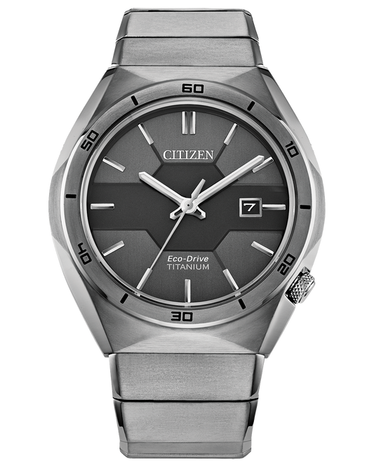The Citizen Watch - Super Titanium Armor AW1660-51H by Citizen features a grey dial, silver hour markers, three hands, date at 3 o’clock, angular bezel with minute markings, and a sleek metallic band.