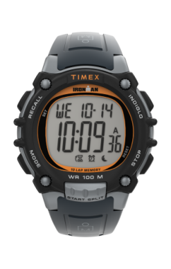 The Timex Ironman Watch (TW5M645009J) features a large digital display with time, date, weekday, and function icons. It has a black/gray band with orange accents and is water resistant—designed for style and durability.