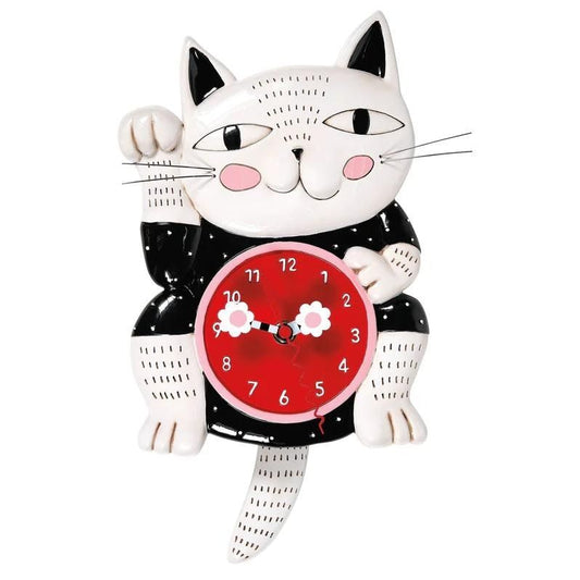 The Enesco Allen Designs Clock - Lucky Cat Wall Clock (6014456) features a whimsical black and white lucky cat with pink cheeks, a red belly clock, swinging tail pendulum, and charming flower-tipped hands.
