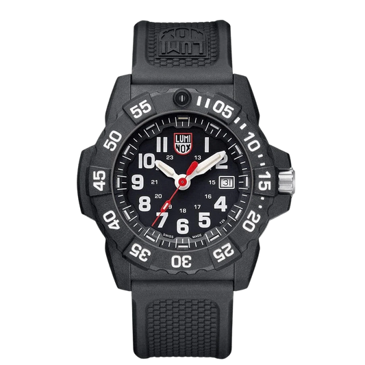 The Luminox Navy SEAL XS.3501.F watch features a rugged black CARBONOX case, bold white numerals, self-powered illumination, red-tipped second hand, date at 3 o'clock, and a textured black rubber strap.