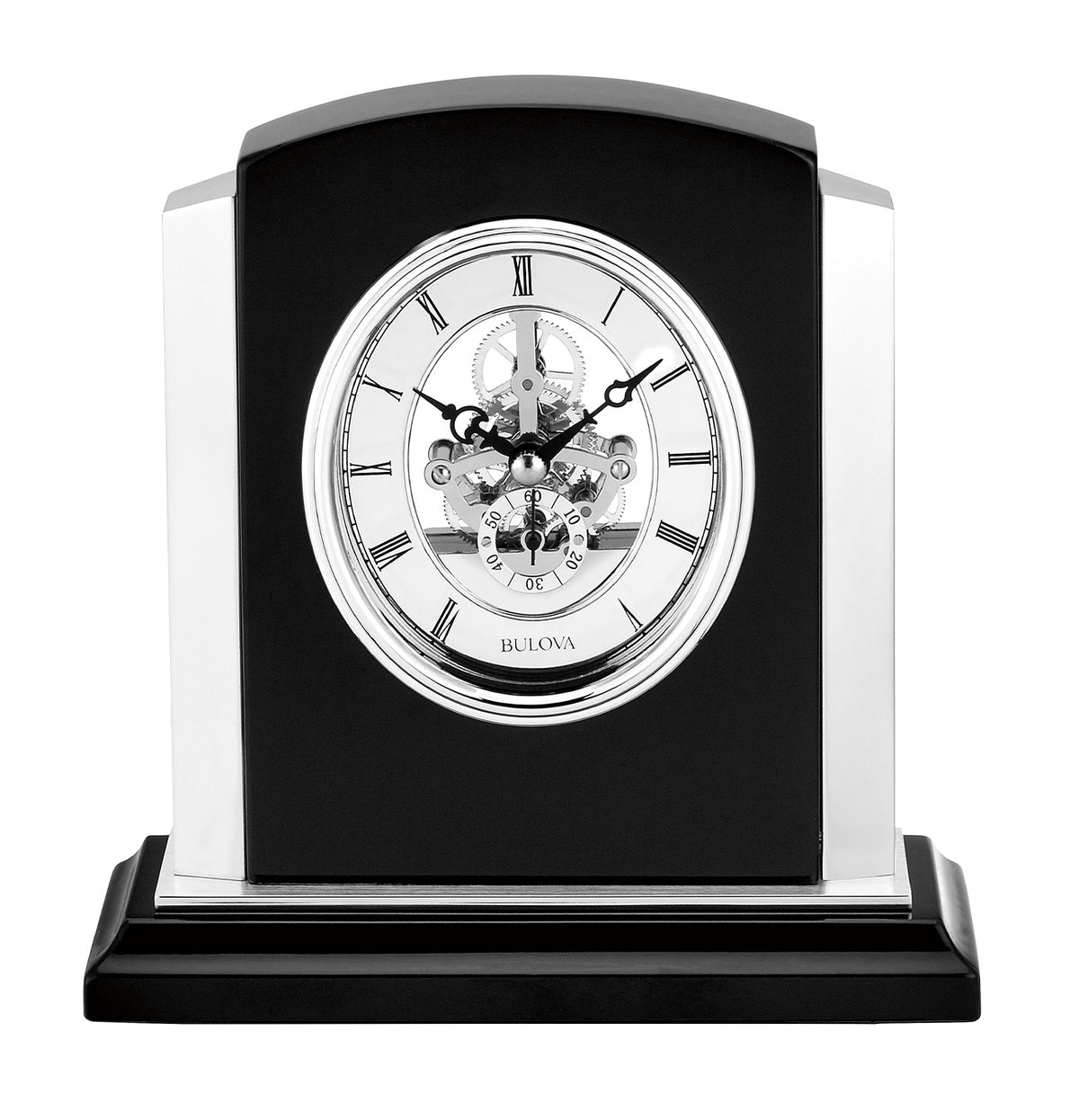 Bulova Clock - Faith - B1715 table clock featuring a skeleton movement, silver Roman numerals, and a black frame on a solid wood rectangular base.