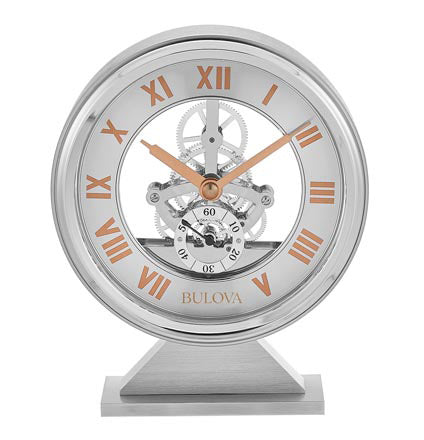 Bulova Clock - Torrance - B1721 skeleton desk clock with a solid wood case, silver frame, copper-colored Roman numerals, and exposed gear movement.
