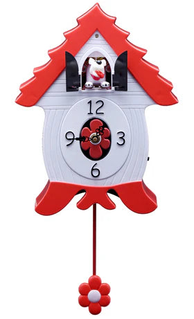 The North Coast Imports BarkCoo Clock (DOG) - 10108 is a red and white clock with a flower-shaped pendulum, black numbers and hands, and a small dog figure above the face.