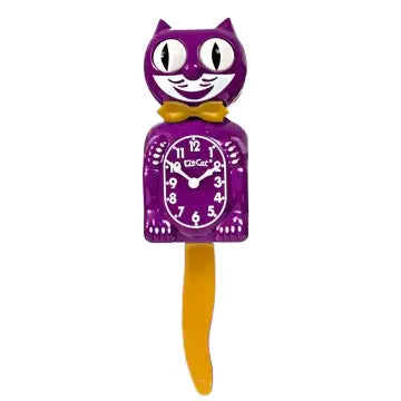 The California Clocks Kit-Cat Klock - Boysenberry Gold Gentleman (BC-49 Gold) is a whimsical wall clock shaped like a cat, featuring a purple (Boysenberry) body with gold accents, large eyes, a yellow bow tie, and an orange swinging tail. Its analog clock face sits on the cat’s belly, adding playful charm to any room.