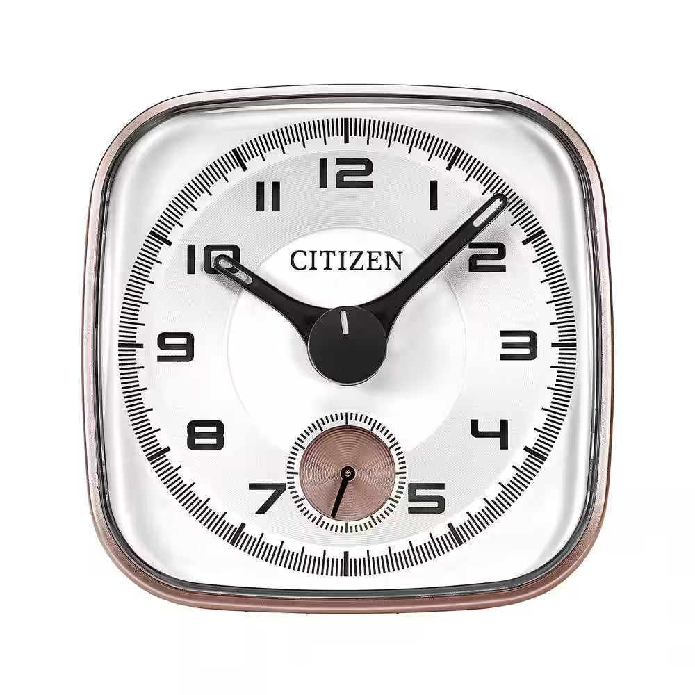 A square CC2102 CITIZEN ALARM CLOCK by Citizen displays the time as 10:08, featuring a small second hand dial at the bottom. The clock has black numbers and hands on a white face, complemented by a classic chrome plated alarm.