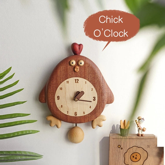 The Senser Woodcraft - Wooden Wall Clock - Chick-a-Tick is a charming, handcrafted chick-shaped clock that adds playful, nature-inspired decor to any space—perfect above a shelf with chick-themed accents and plants.