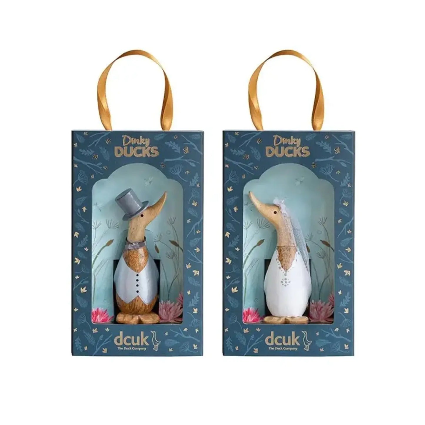 The Enesco DCUK Ducks Dinky Wedding Set (6018580) features two boxed bamboo ducks dressed as bride and groom, with a gray top hat and bow tie, white veil, blue box designs, and gold ribbon handles—ideal as wedding favors.