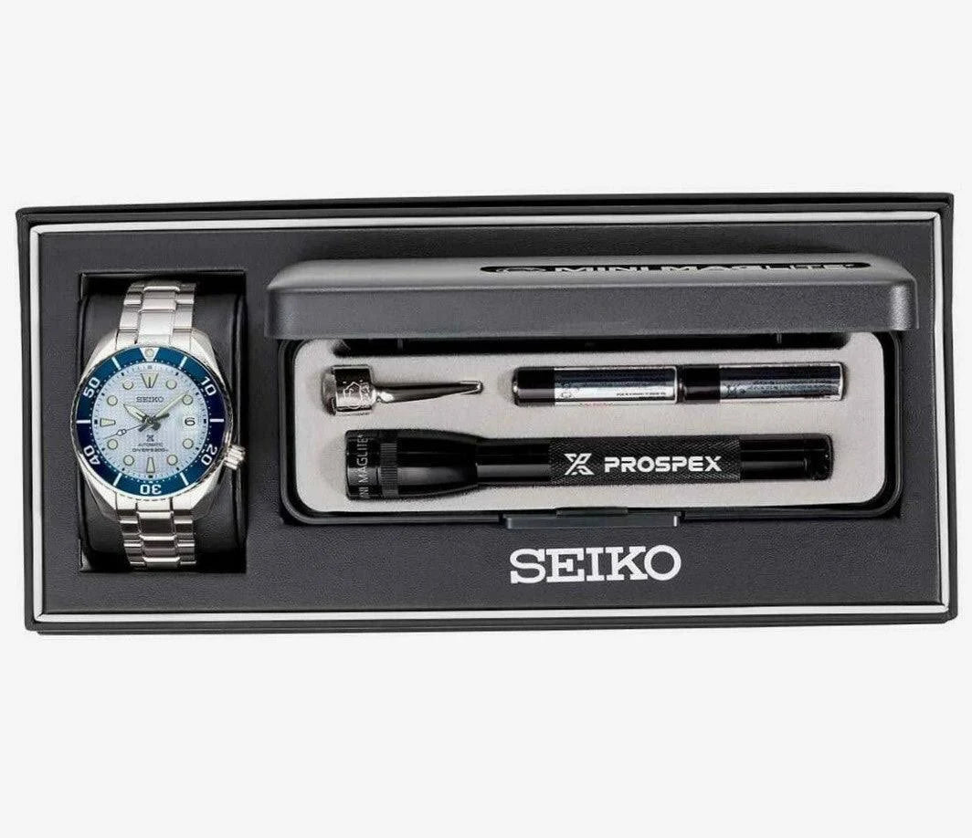 The Seiko Luxe Ice Diver Special Edition (SPB179) gift set includes a silver-blue wristwatch, Prospex flashlight, two watch tools, all presented in a sleek black Seiko-branded box.