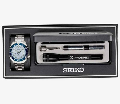 The Seiko Luxe Ice Diver Special Edition (SPB179) gift set includes a silver-blue wristwatch, Prospex flashlight, two watch tools, all presented in a sleek black Seiko-branded box.