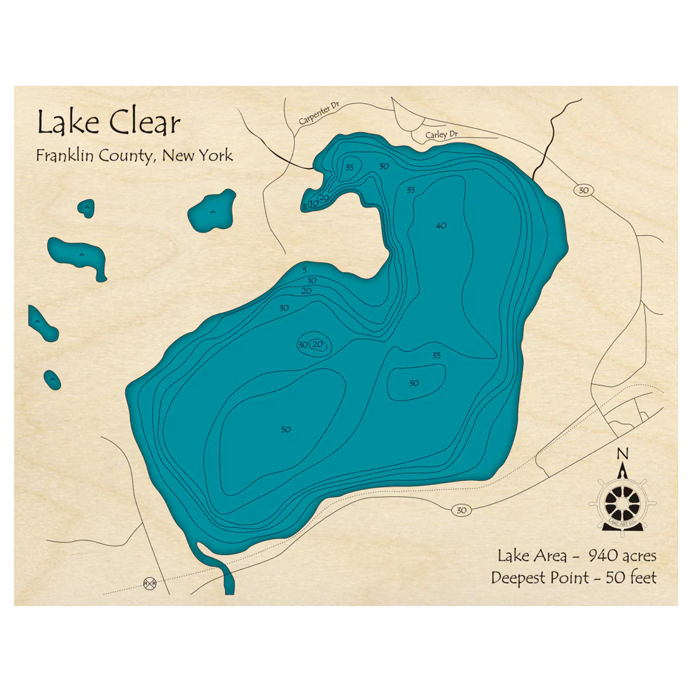 The Lake Art "Lake Clock - Lake Clear Franklin County, NY" features a detailed map with contour lines for water depths, nearby roads, and a compass. The lake covers 940 acres and is 50 ft deep—an ideal custom wooden wall clock.