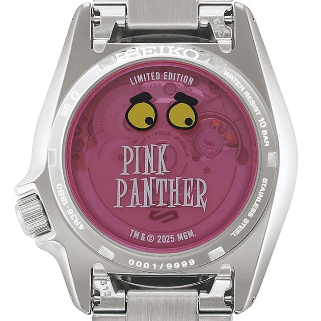 The transparent case back of a Seiko Watch - Seiko 5 Pink Panther Limited Edition - SRPM07 shows the Pink Panther’s eyes and text over an internal mechanical movement.