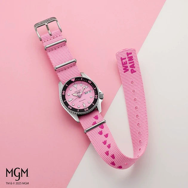 Seiko 5 Pink Panther Limited Edition - SRPM07 watch with a pink dial, black bezel, and pink nylon strap featuring a paw print pattern and the text WET PAINT.