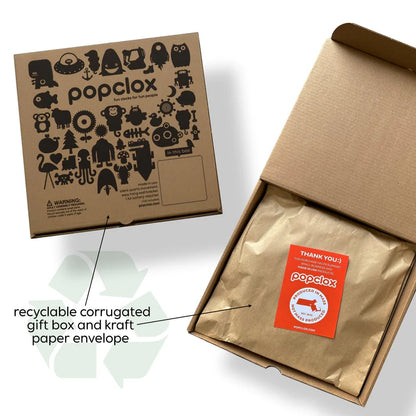 A brown Popclox gift box, decorated with black illustrations, is partially open to reveal a kraft-wrapped Popclox French Bulldog Pendulum Clock (PCPEN147) and an orange thank you card. Text and arrow emphasize its recyclable packaging.
