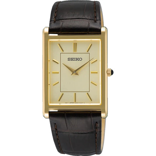 The Seiko Watch SWR106 from the Essentials Collection features a rectangular gold case, light gold dial, gold markers, brown leather strap, minimalist single crown design, and durable sapphire crystal.