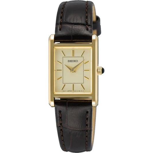 The Seiko Essentials Collection SWR110 is a rectangular watch with a gold case, cream dial, gold hour markers, and a dark brown crocodile-pattern leather strap, featuring durable sapphire crystal.
